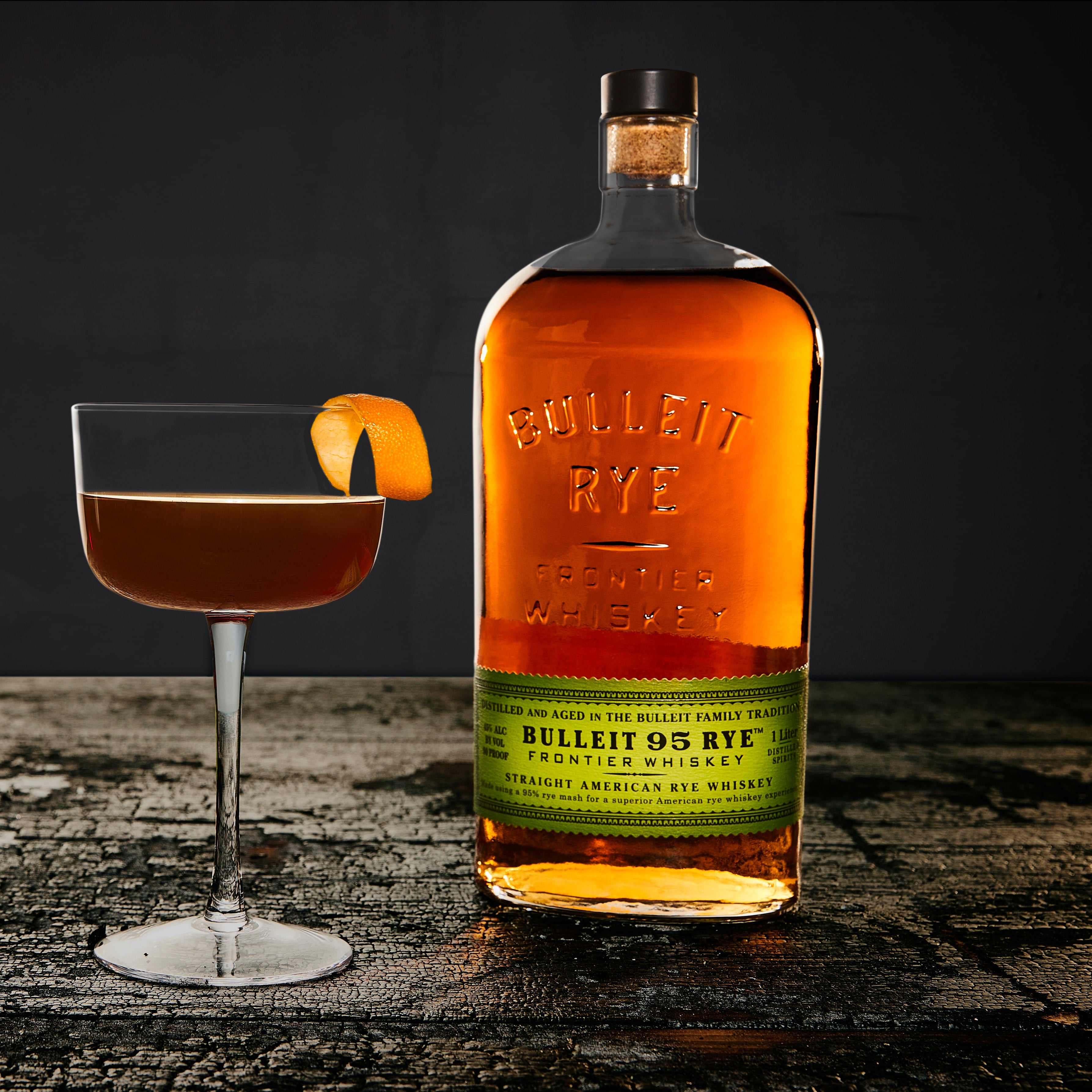 Bulleit_Bourbon_Evergreen_Social_Shoot_Revolver_Cement_F23_Q3_Social_Asset_16x9_75d811d3-32a6-48ef-8997-cf7dbc582174.jpg